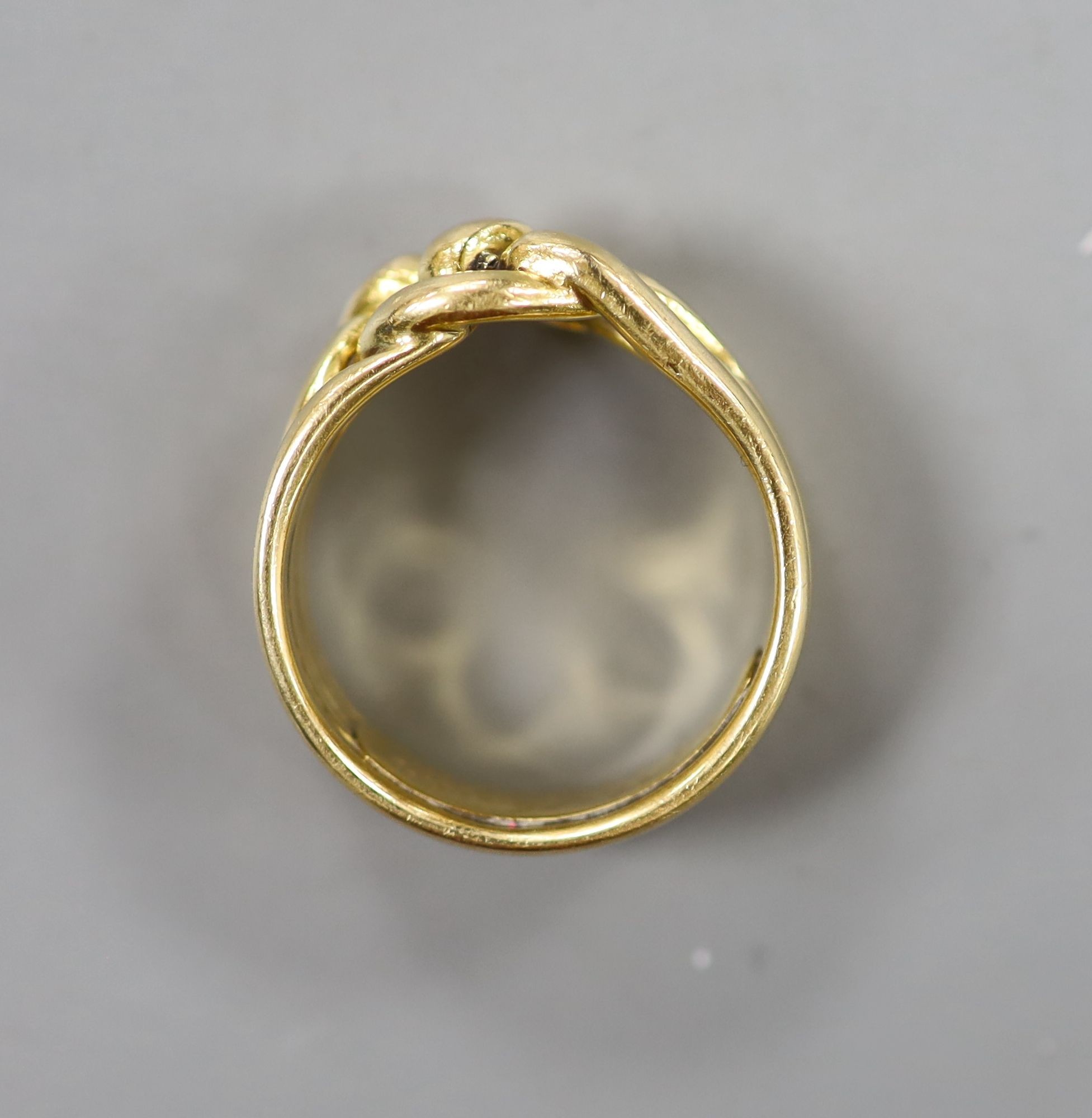 A Victorian yellow metal quadruple band knot ring, inscribed 'Joseph Massie August, 1883' size P/Q, 12.5 grams.